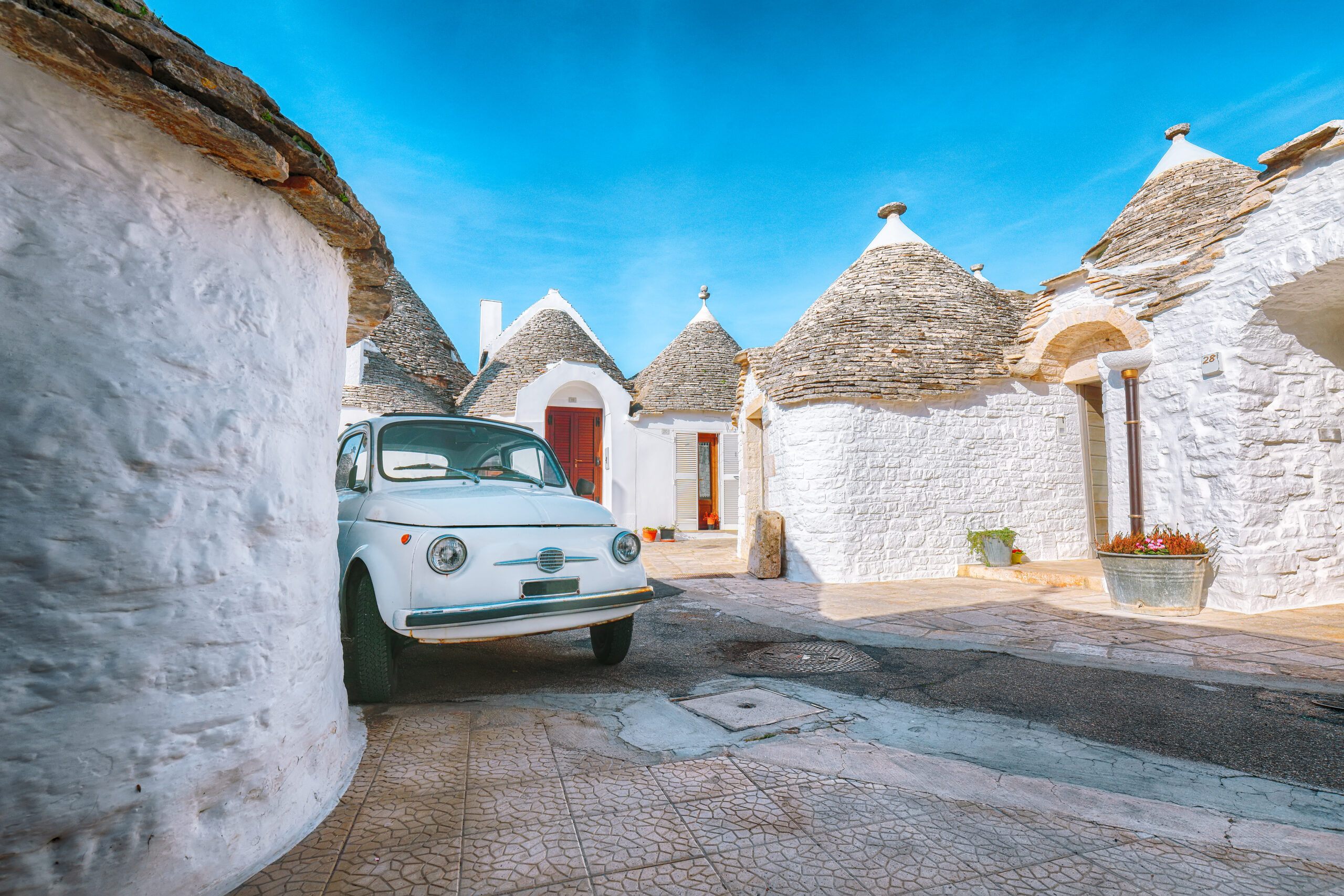 Trulli of Alberobello typical houses street view. Town of Alberobello, village with Trulli houses in Puglia Apulia region, Southern Italy